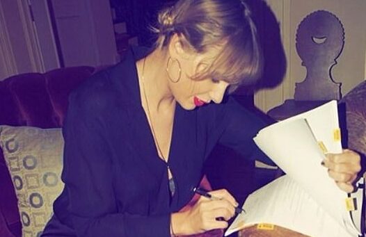 Taylor Swift signing a contract